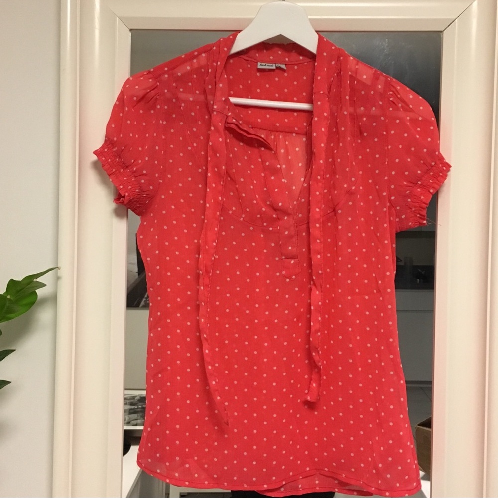 Sheer coral blouse with white polka dots